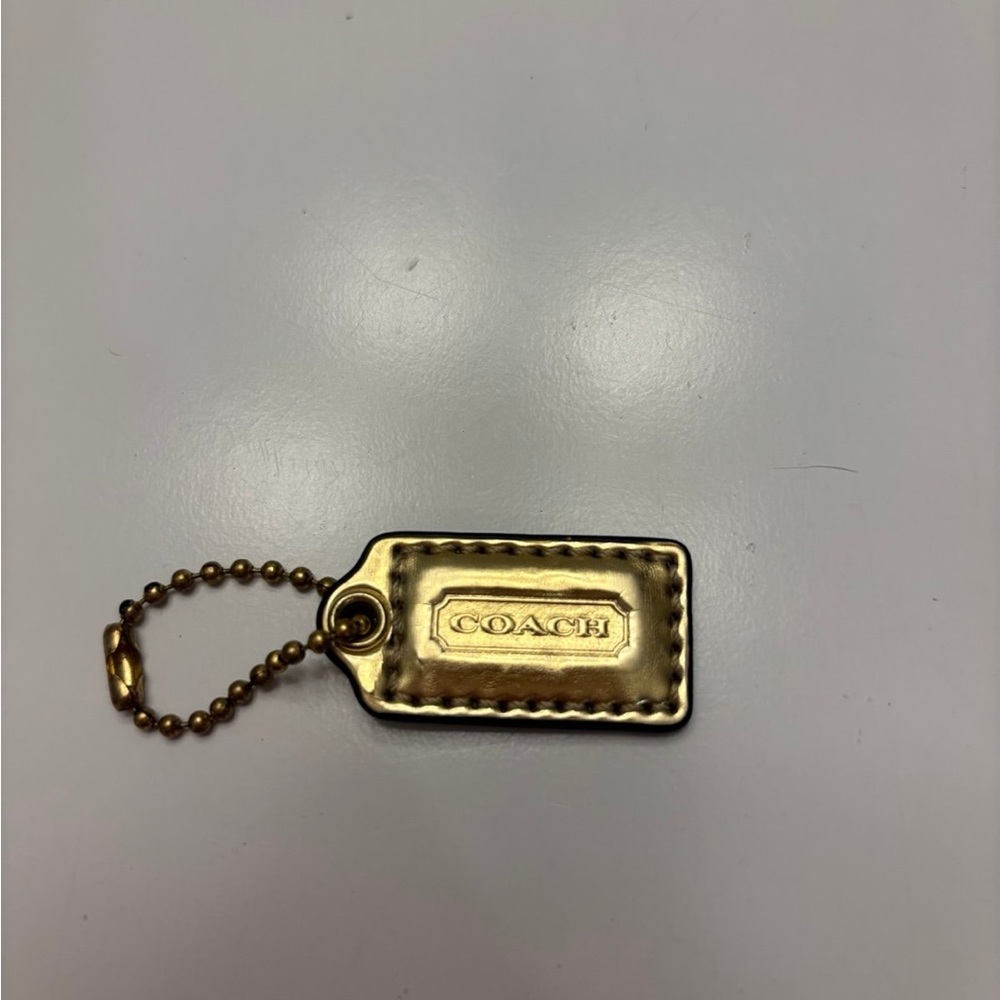 Coach gold leather handbag charm or keychain hangtag